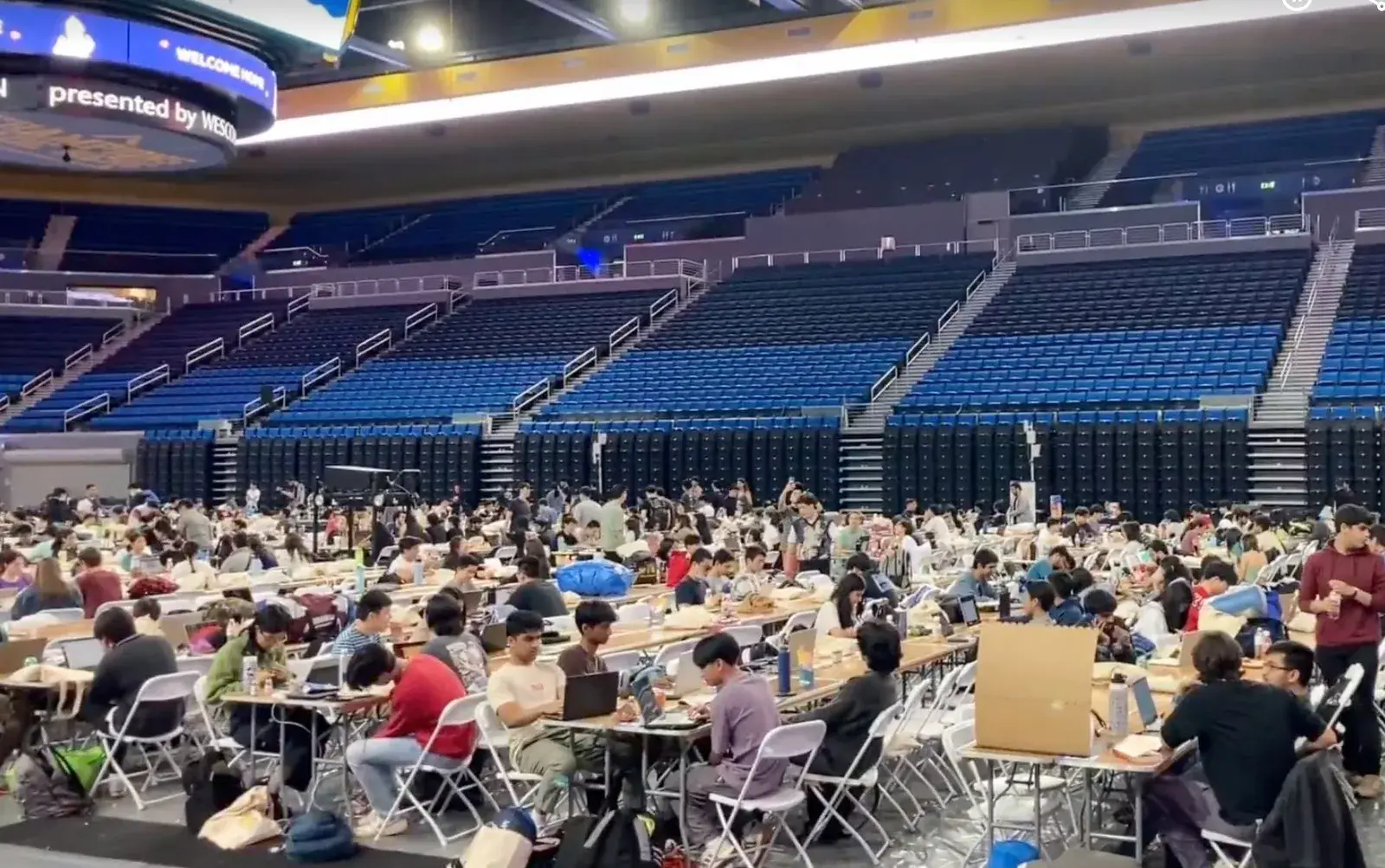 Arena floor filled with attendees during a high-density event