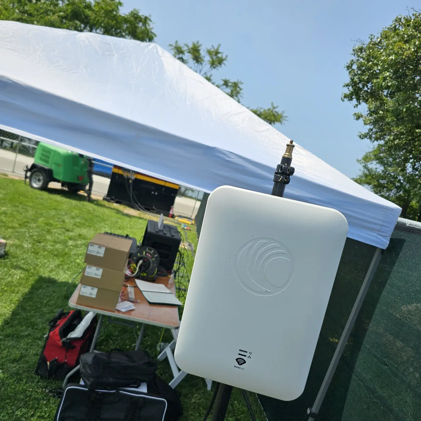 Cambium Solutions technician installing an outdoor wireless access point