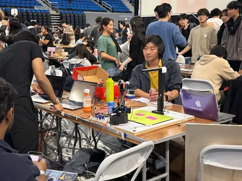 Students working on laptops across a high-density campus space
